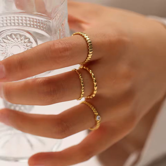 Hand wearing two gold rings with a blurred background-Waterproof Gold Plated Jewellery -Adjustable Ring